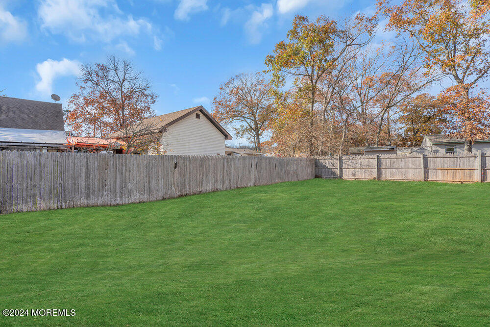 22 Spinnaker Way Waretown, NJ 08758 - Photo 28 of 29 a view of a backyard with green space