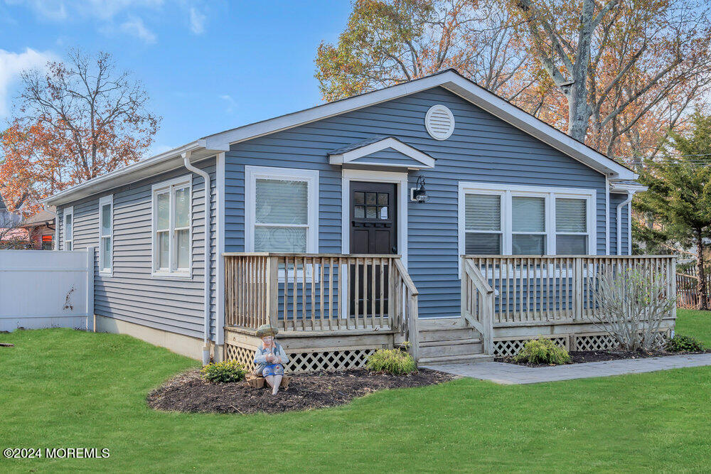 22 Spinnaker Way Waretown, NJ 08758 - Photo 6 of 29 a front view of a house with a garden