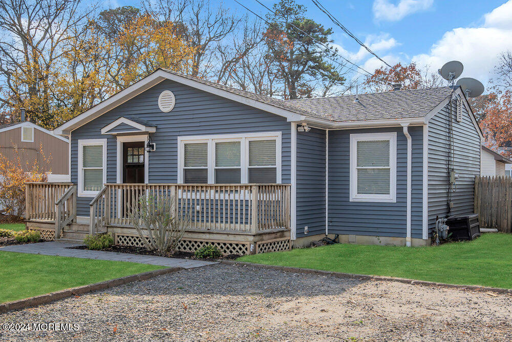 22 Spinnaker Way Waretown, NJ 08758 - Photo 7 of 29 a front view of a house with a garden