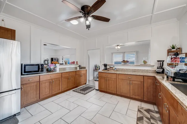a kitchen with sink cabinets and window