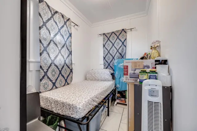 a bedroom with a bed and a table in it