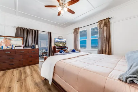 a bed room with a bed and a large mirror