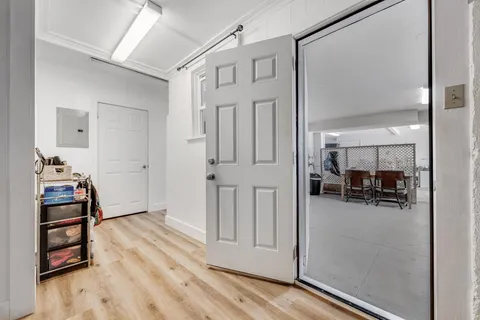 a living room with furniture and a piano