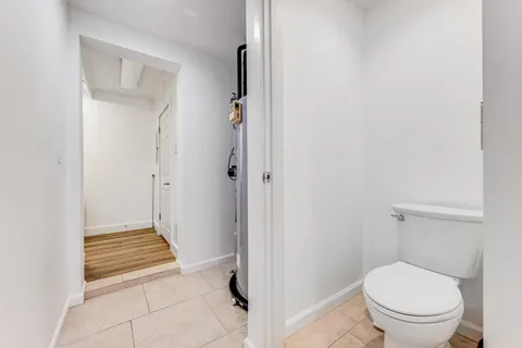 a view of a livingroom with furniture and a window