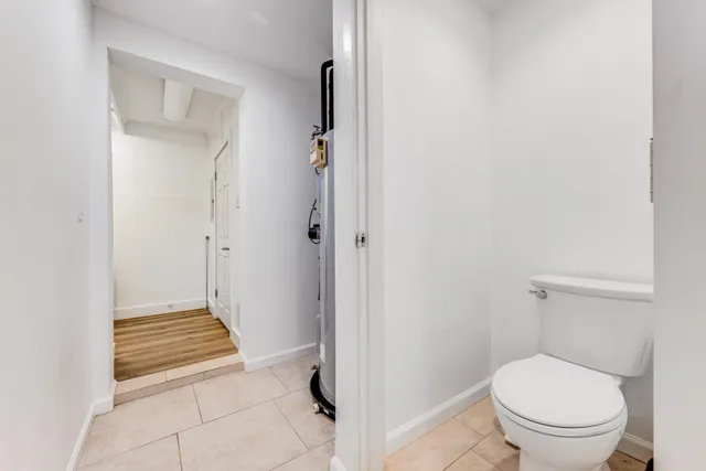 a view of a livingroom with furniture and a window