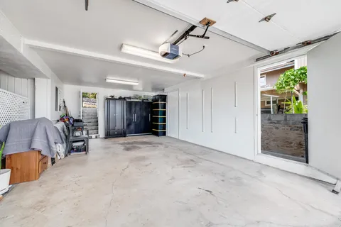 a bedroom with a bed and a view of walk in closet