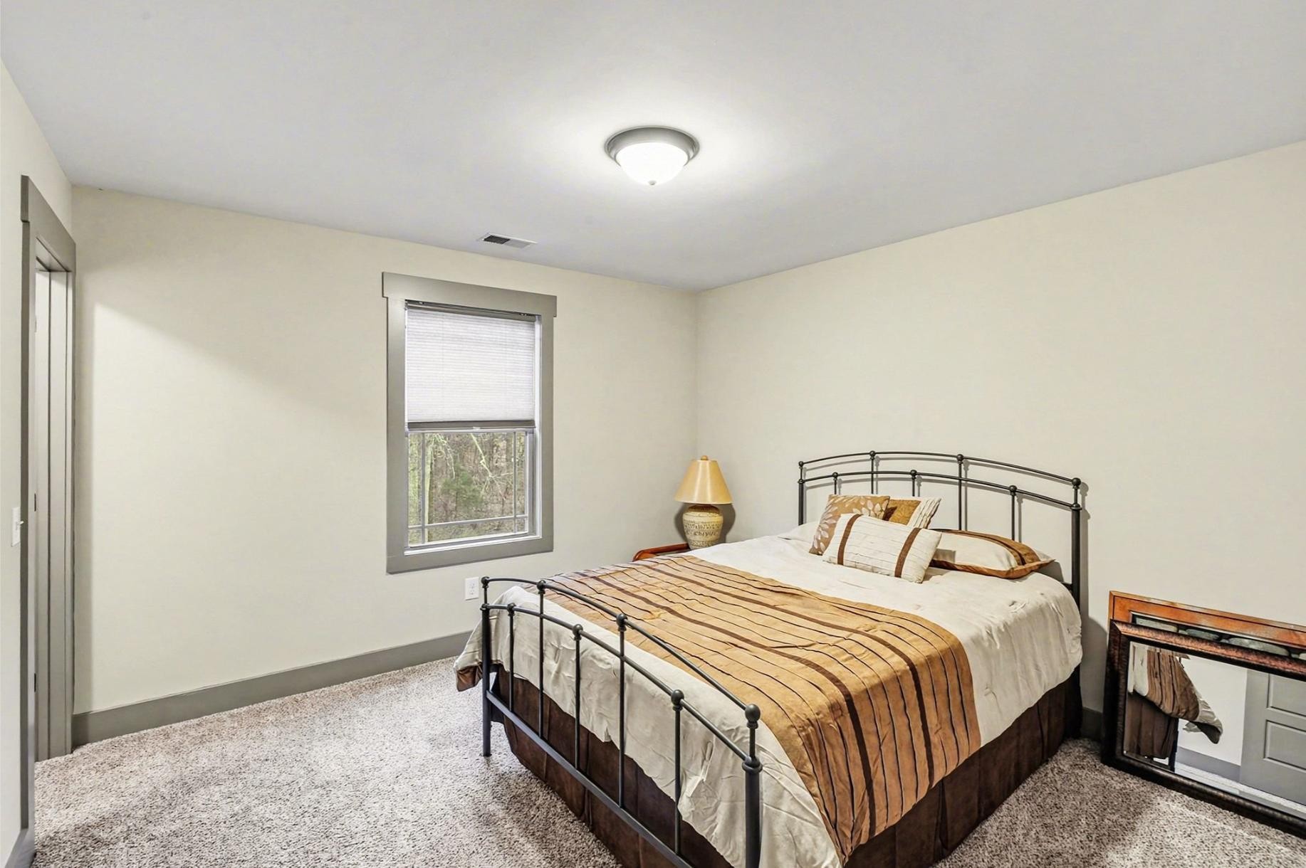 548 Strudwick Avenue Goodlettsville, TN 37072 - Photo 28 of 54 a bedroom with a bed and a window