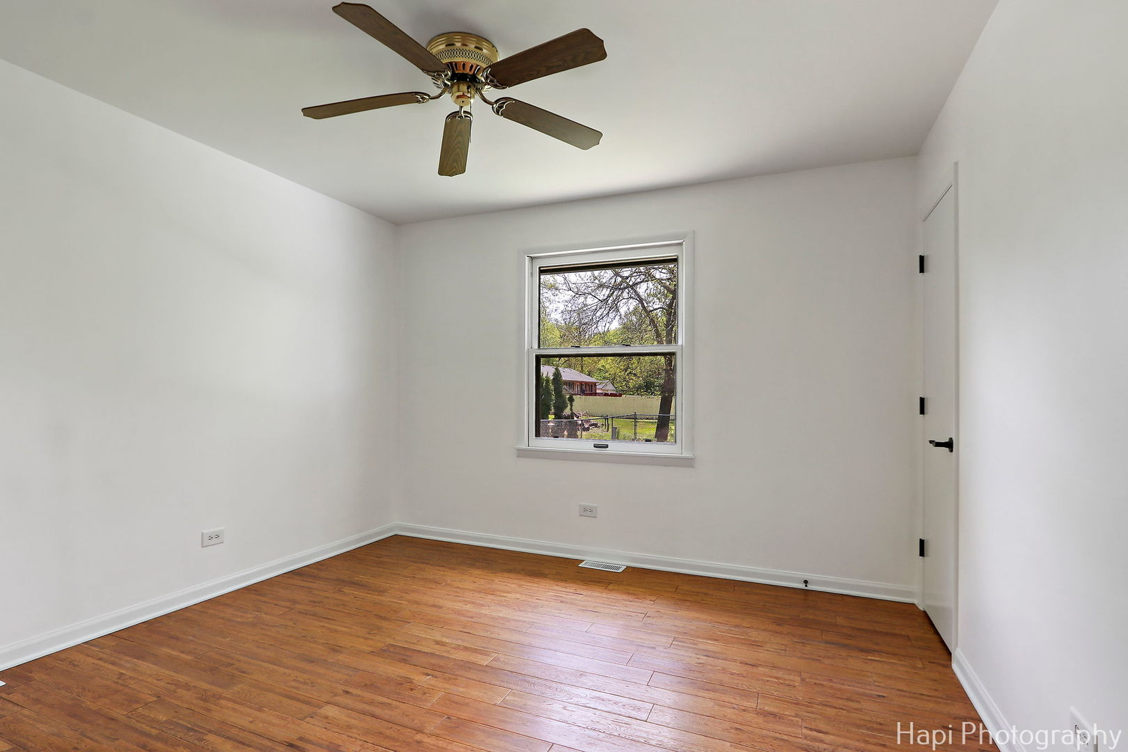 305 Pokagon Drive Algonquin, IL 60102 - Photo 15 of 28 an empty room with wooden floor and windows