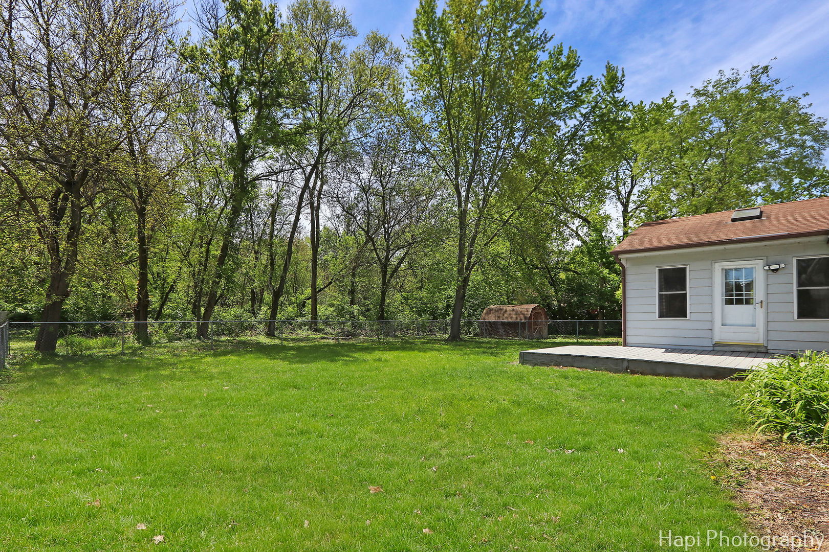 305 Pokagon Drive Algonquin, IL 60102 - Photo 20 of 28 a backyard of a house with table and chairs