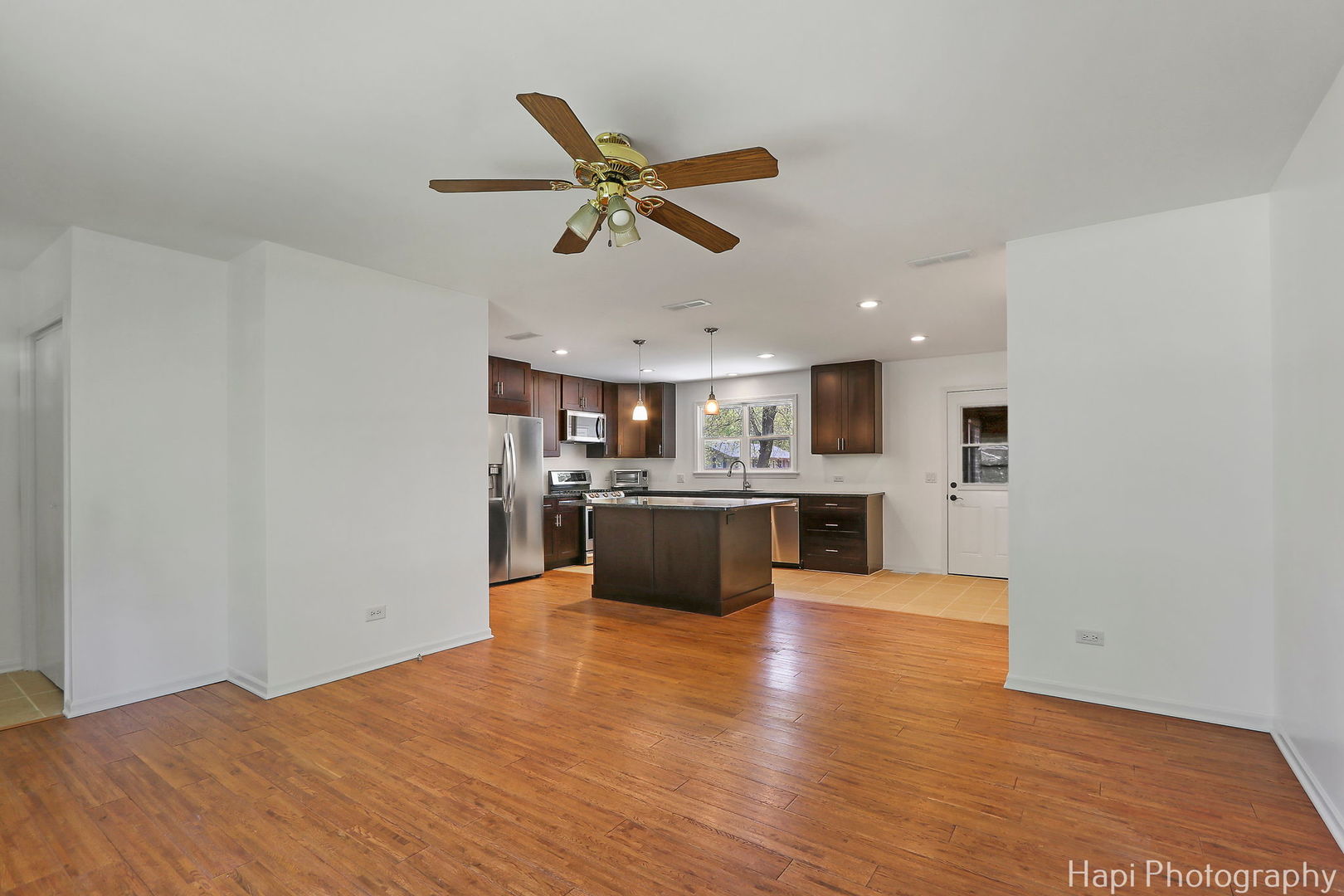 305 Pokagon Drive Algonquin, IL 60102 - Photo 5 of 28 a view of a kitchen with a sink stainless steel appliances and cabinets
