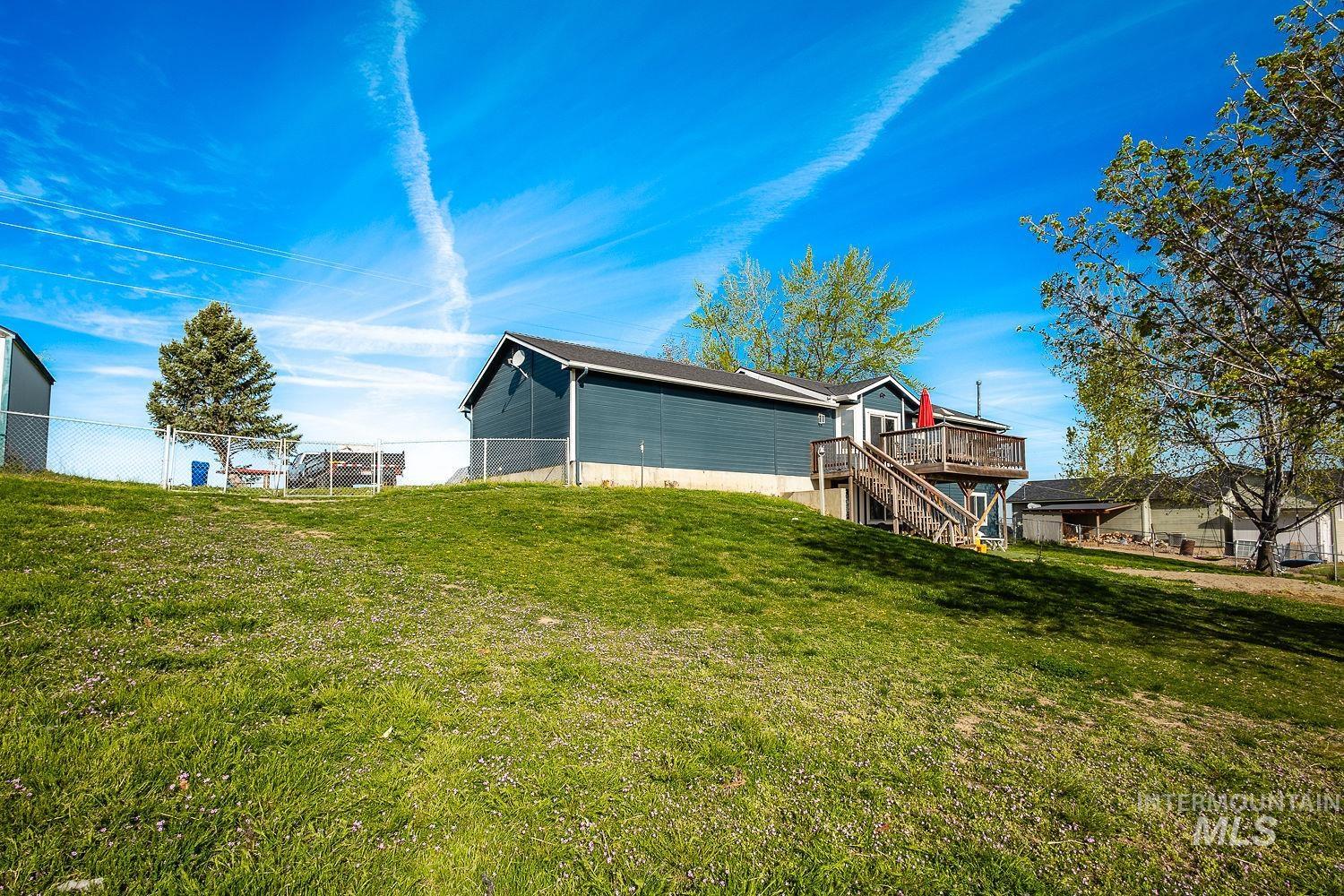 3950 Cassia Road New Plymouth, ID 83655 - Photo 4 of 26 Rear view of property featuring stairway and a deck