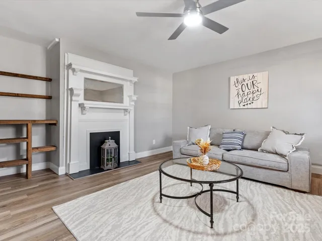 a living room with furniture and a fireplace