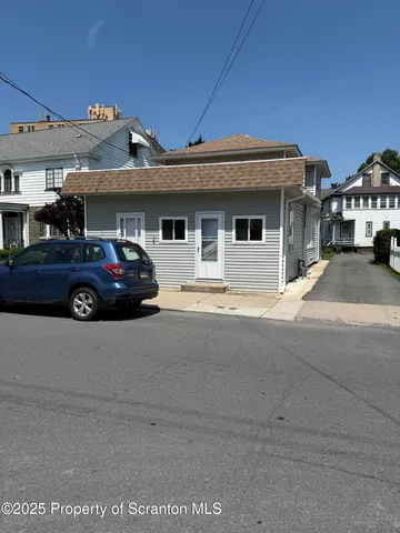 a car parked in front of a house
