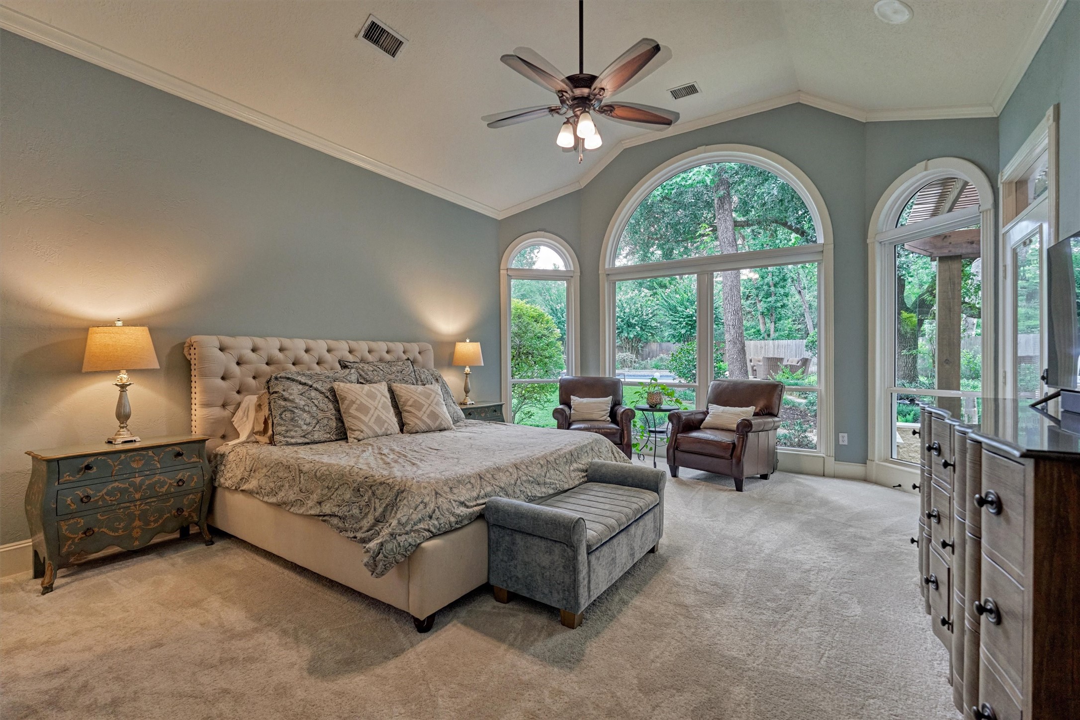 18 Treevine Court The Woodlands, TX 77381 - Photo 21 of 50 Wow! A glorious primary suite is tucked away with picturesque views from every directions, including private access to the patio.