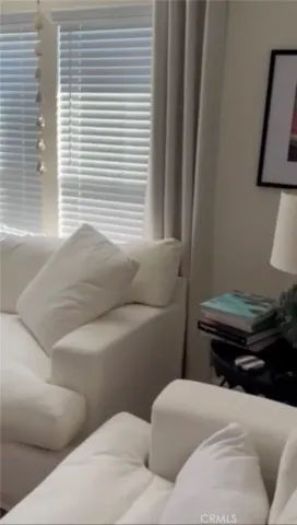 a living room with a couch and a stove top oven