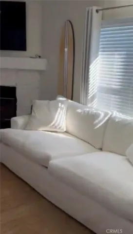 a view of fireplace and wooden floor