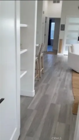 a living room with a couch and a stove top oven