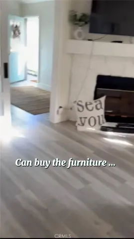 a living room with a couch and a window