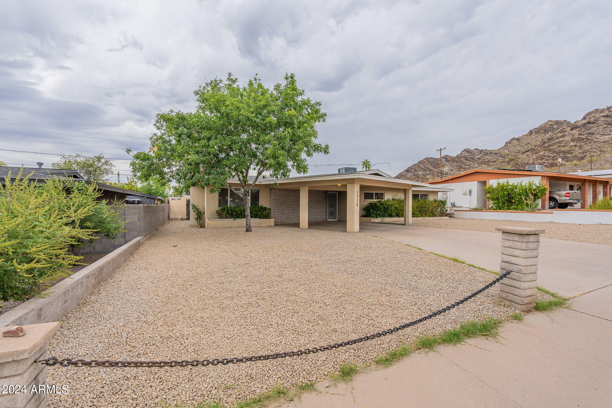 1320 East Orchid Lane Phoenix, AZ 85020 - Photo 1 of 48 front view of a house with a yard