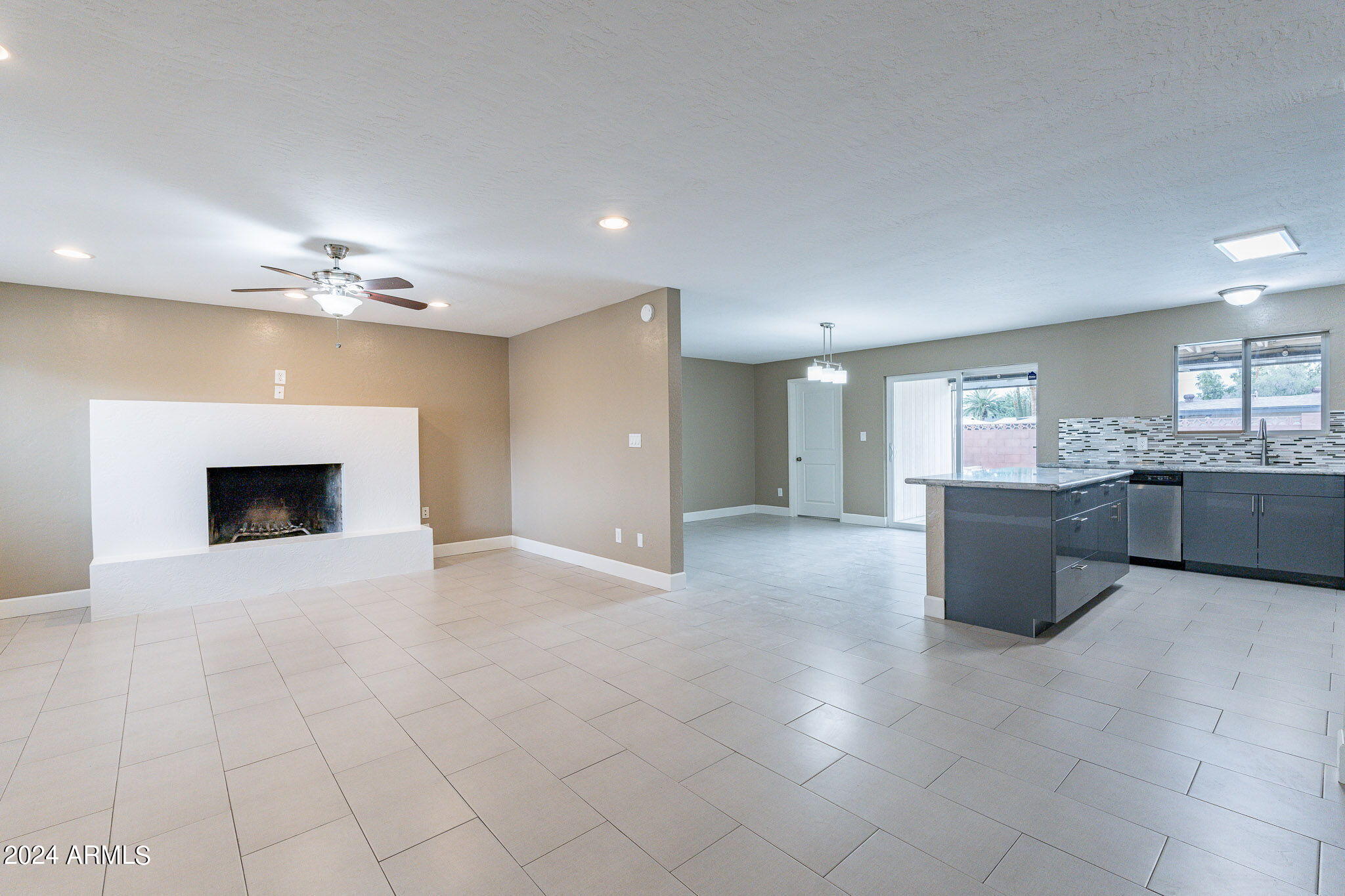 1320 East Orchid Lane Phoenix, AZ 85020 - Photo 11 of 48 a view of a kitchen with a sink and a fireplace