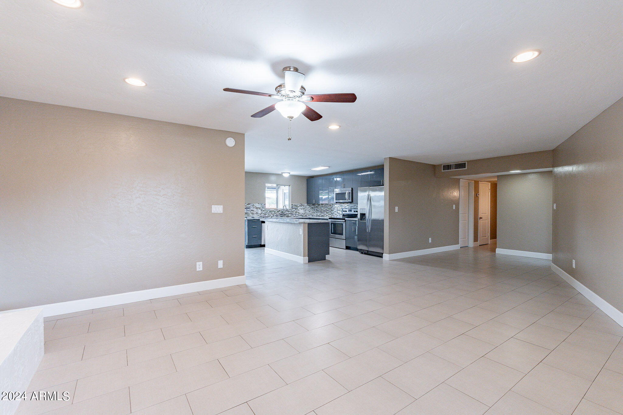 1320 East Orchid Lane Phoenix, AZ 85020 - Photo 12 of 48 a view of a kitchen with a sink and chandelier fan