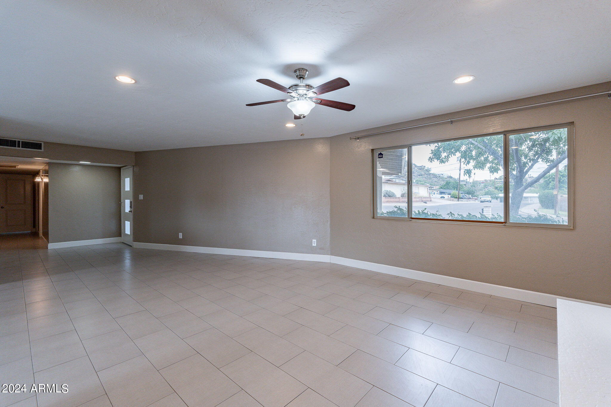 1320 East Orchid Lane Phoenix, AZ 85020 - Photo 13 of 48 a view of an empty room with a window