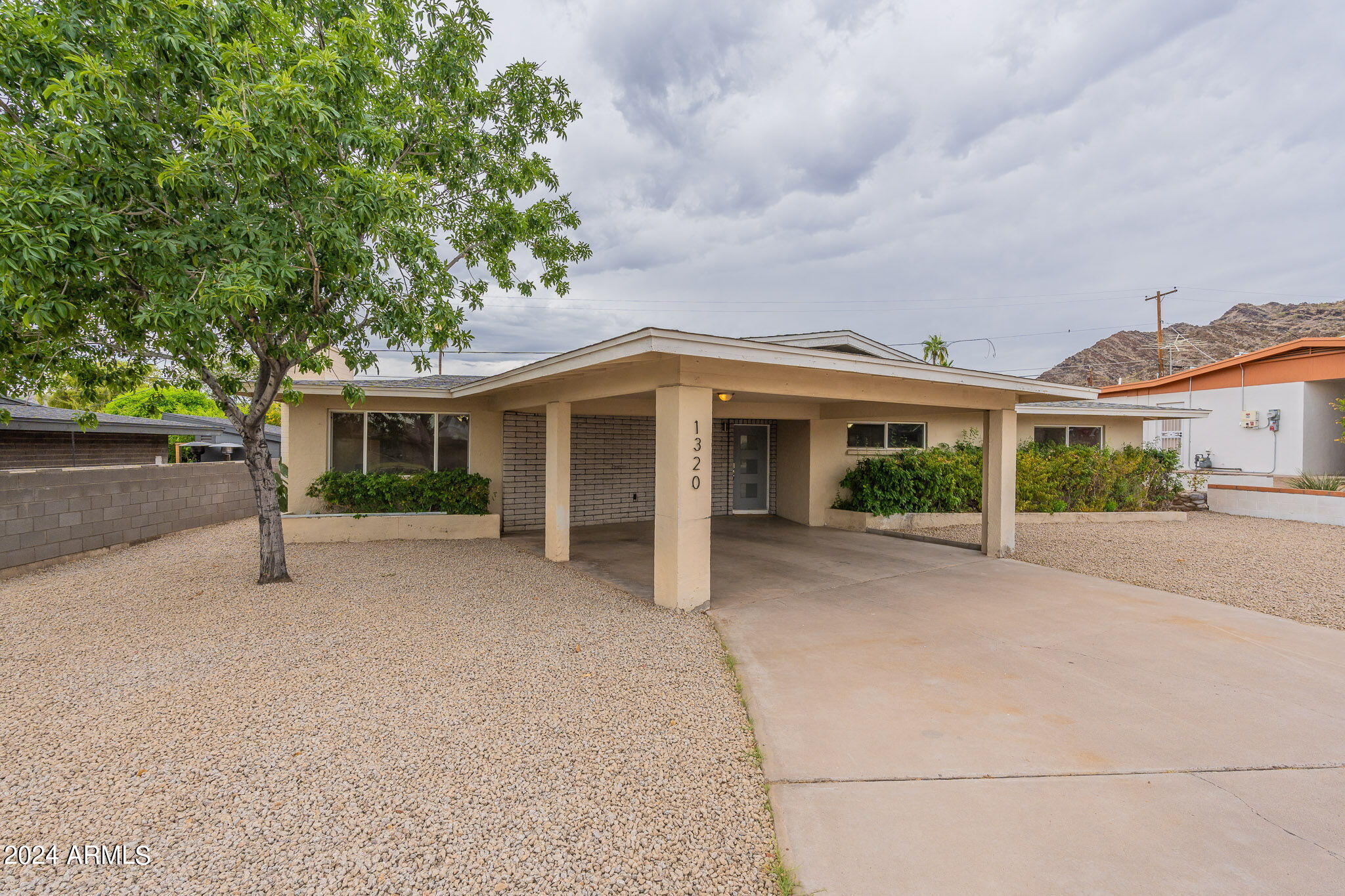 1320 East Orchid Lane Phoenix, AZ 85020 - Photo 2 of 48 front view of a house with a street