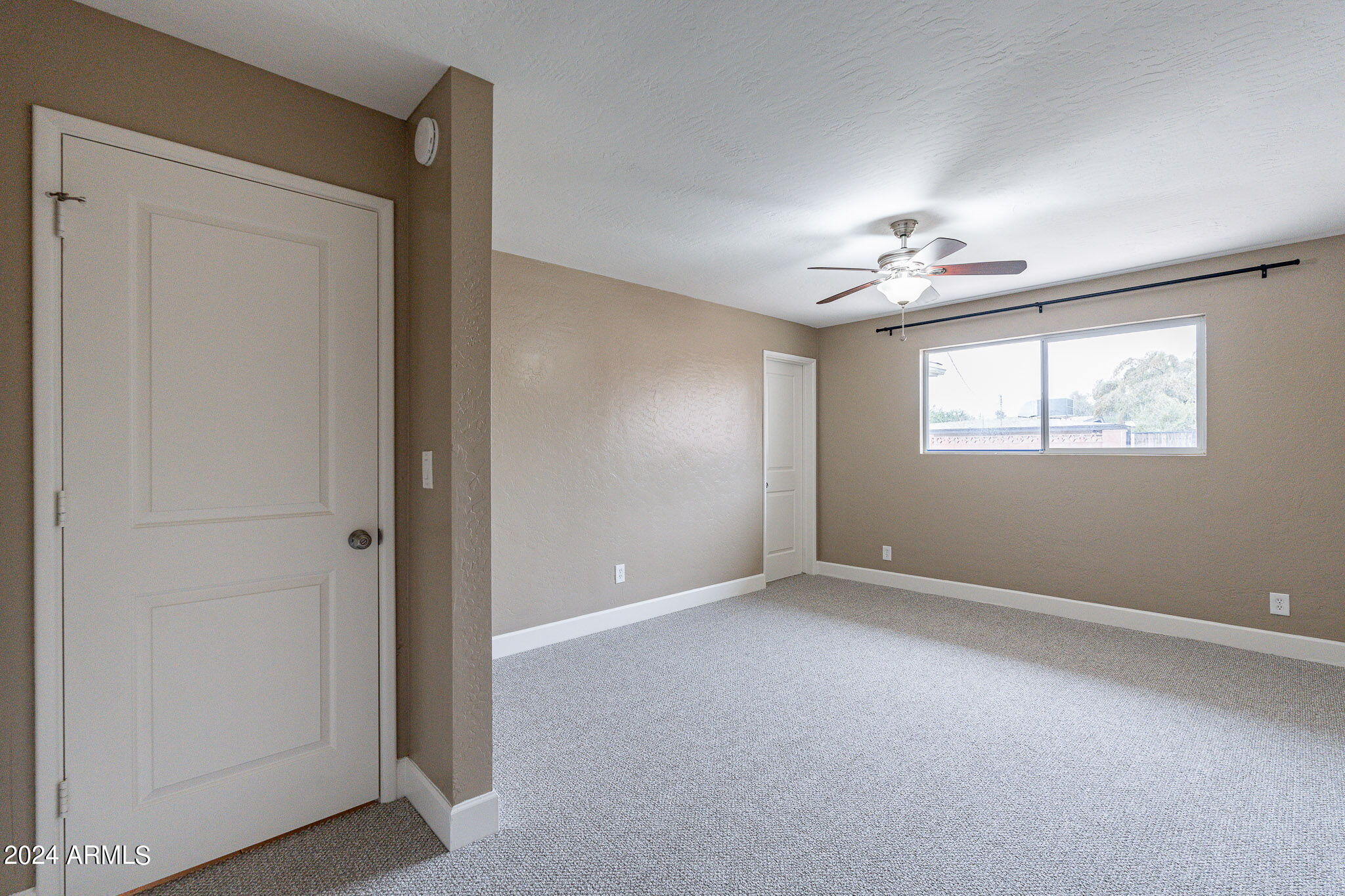 1320 East Orchid Lane Phoenix, AZ 85020 - Photo 24 of 48 a view of an empty room with a window