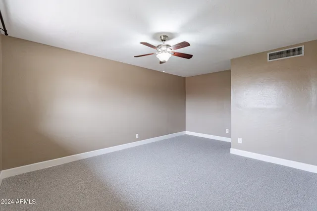 a bathroom with a sink a toilet a mirror and shower