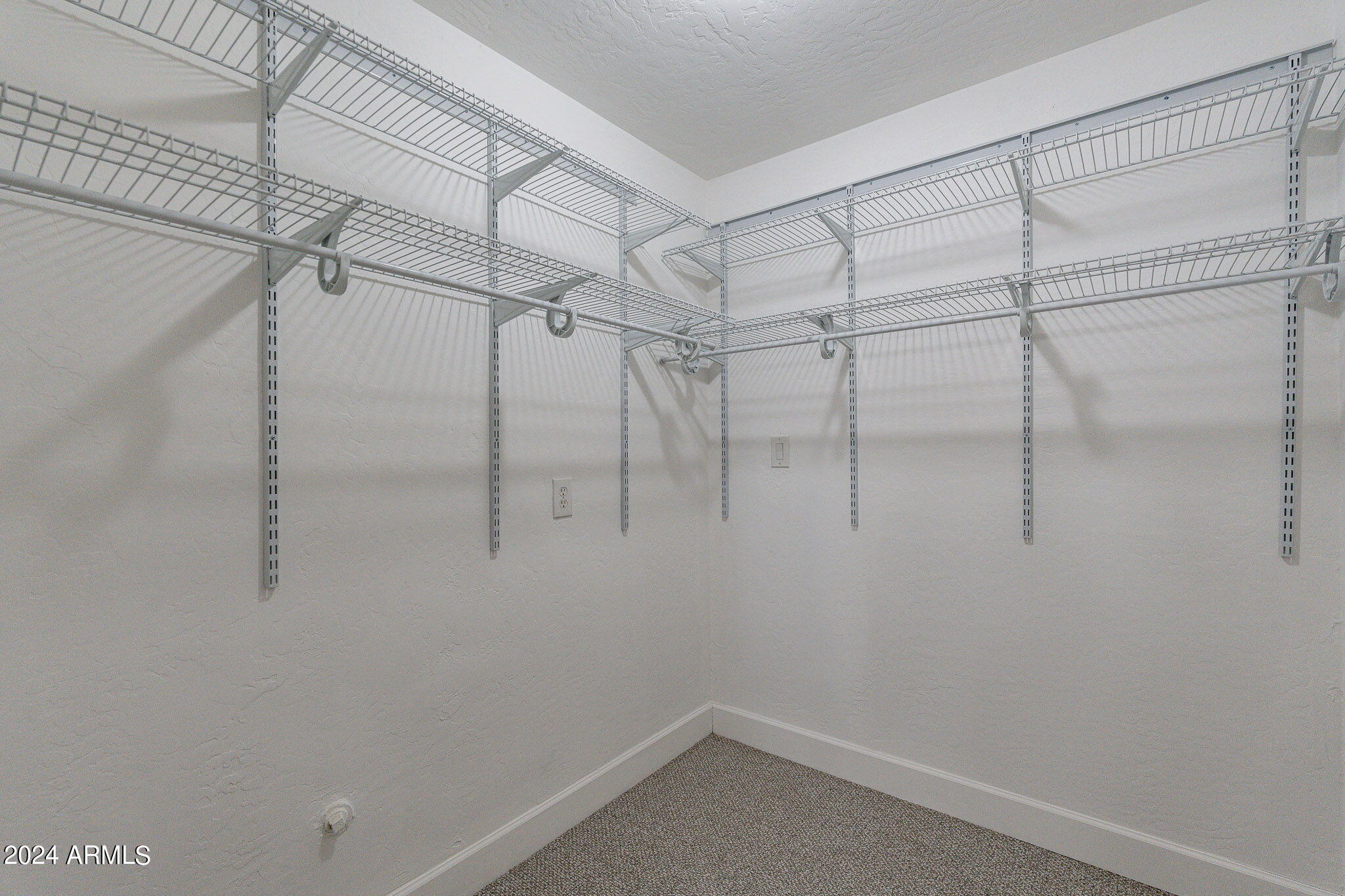 1320 East Orchid Lane Phoenix, AZ 85020 - Photo 30 of 48 a view of a room with racks on the wall