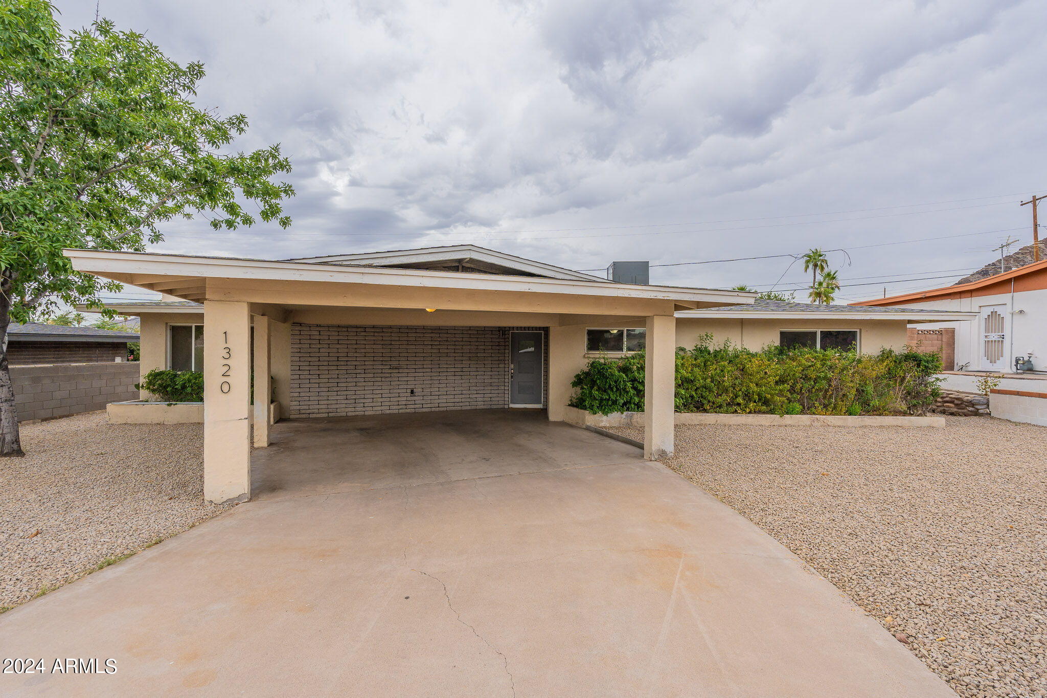 1320 East Orchid Lane Phoenix, AZ 85020 - Photo 3 of 48 front view of a house with a yard