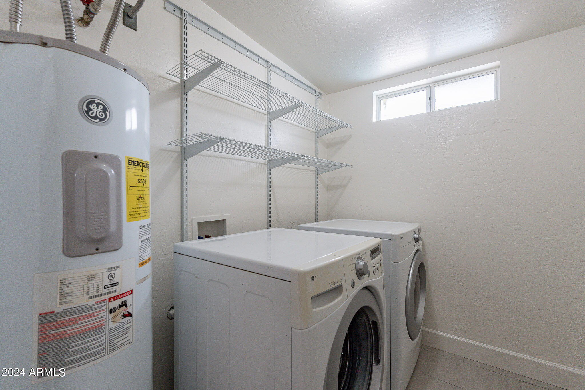 1320 East Orchid Lane Phoenix, AZ 85020 - Photo 37 of 48 a utility room with dryer and washer
