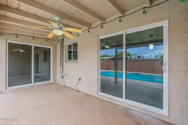 a view of a room with porch and wooden floor