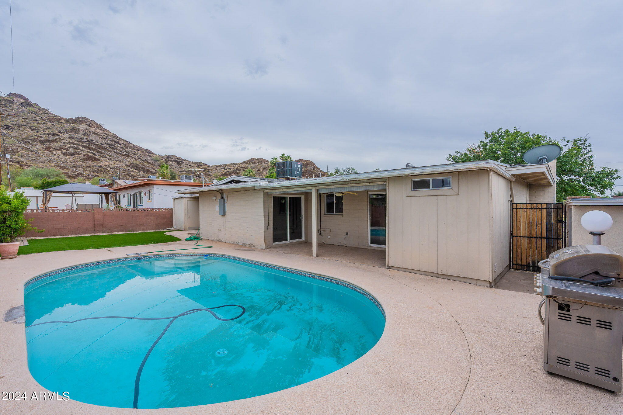 1320 East Orchid Lane Phoenix, AZ 85020 - Photo 41 of 48 a view of a house with swimming pool and furniture