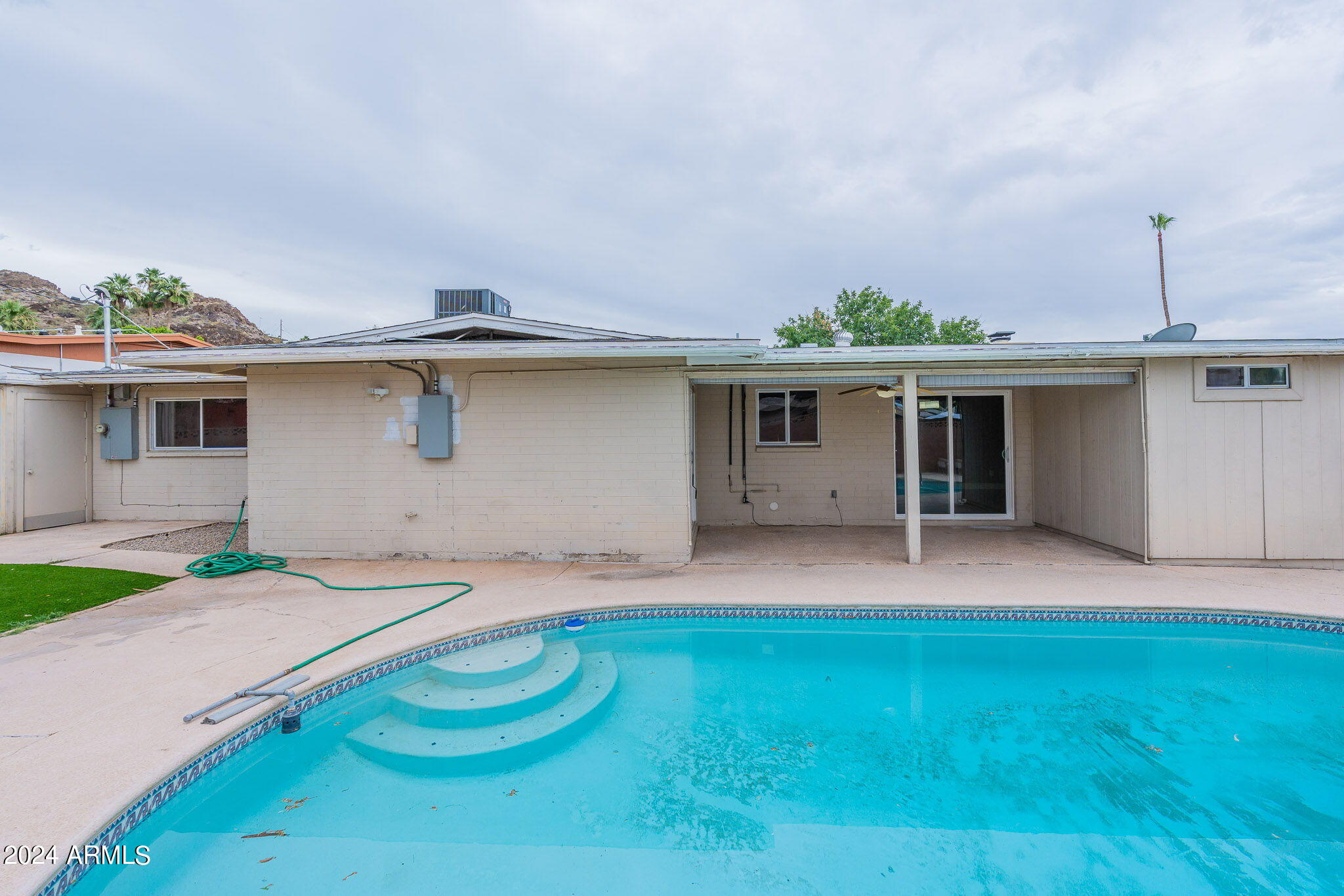 1320 East Orchid Lane Phoenix, AZ 85020 - Photo 42 of 48 a backyard of a house with table and chairs