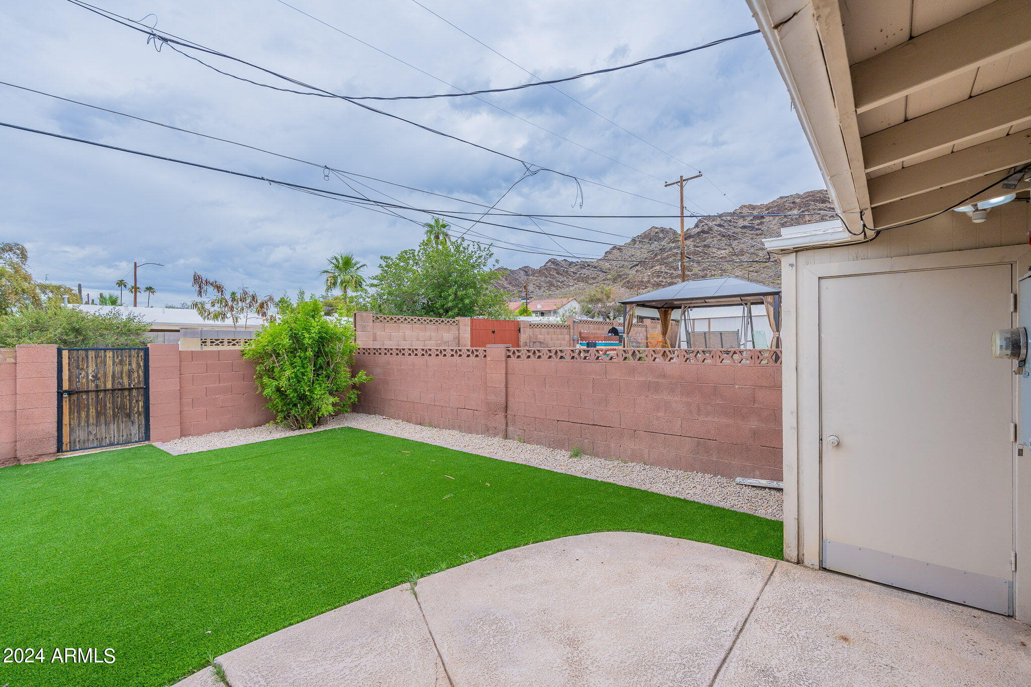 1320 East Orchid Lane Phoenix, AZ 85020 - Photo 45 of 48 a view of a backyard with a garden