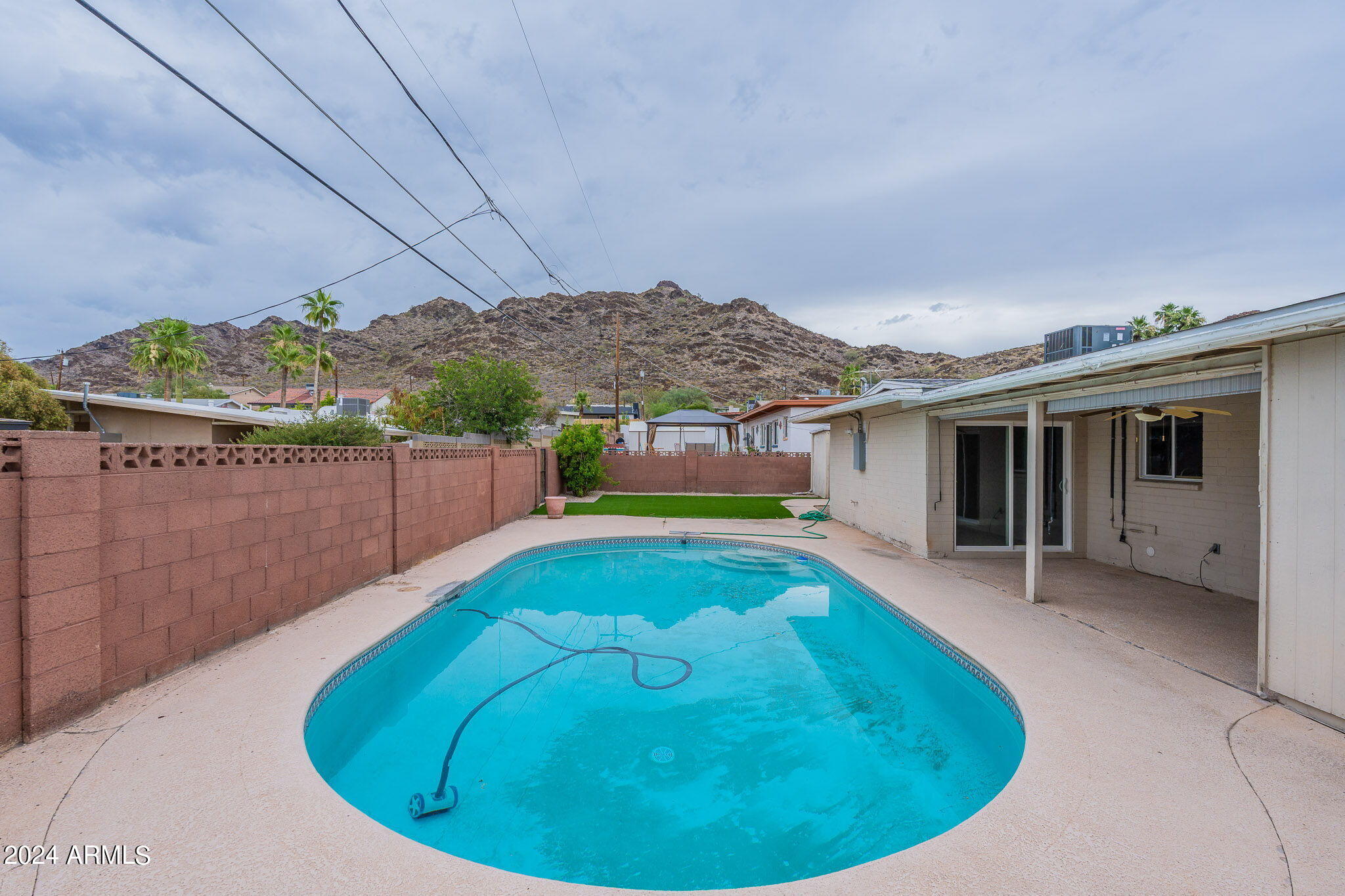 1320 East Orchid Lane Phoenix, AZ 85020 - Photo 48 of 48 a view of a house with a swimming pool