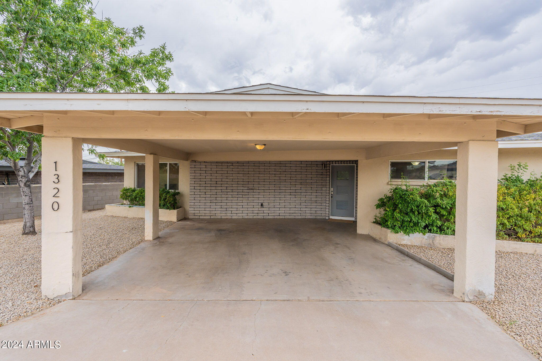 1320 East Orchid Lane Phoenix, AZ 85020 - Photo 6 of 48 front view of a house with a porch
