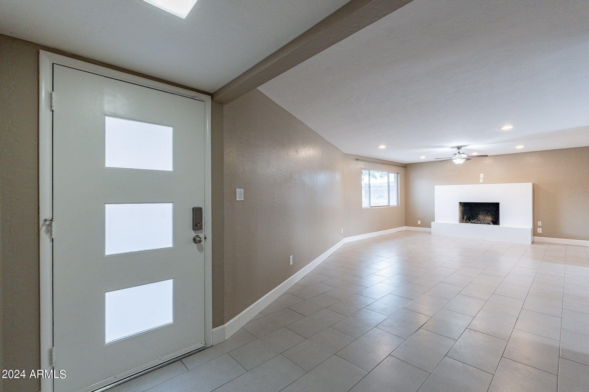 1320 East Orchid Lane Phoenix, AZ 85020 - Photo 8 of 48 a view of an empty room with a window