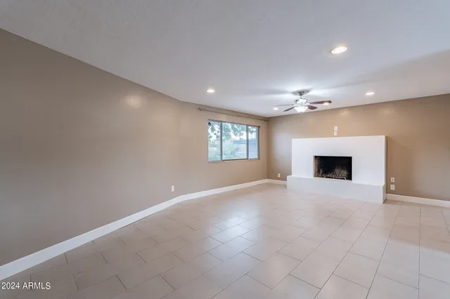 a view of a kitchen with a sink and a fireplace