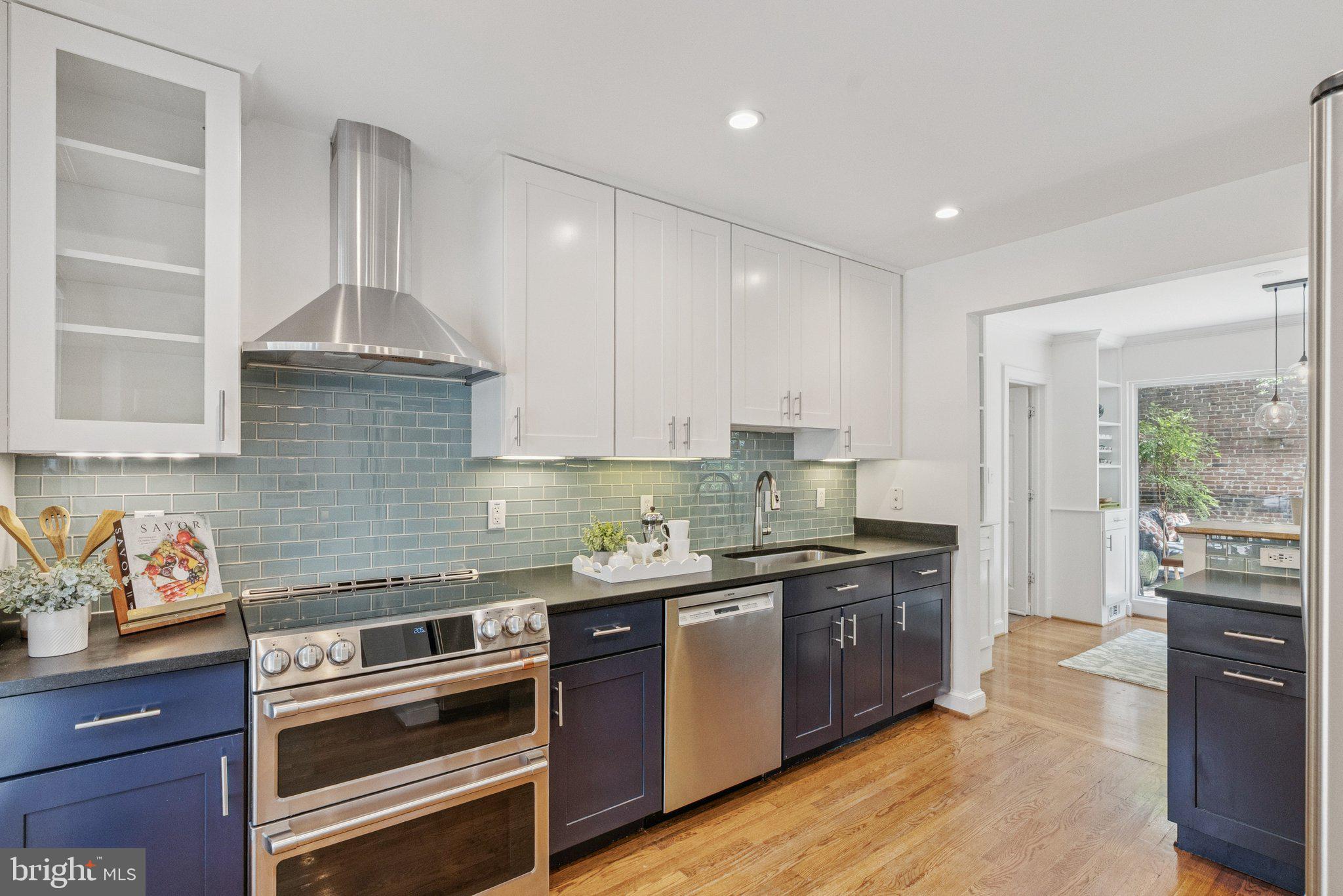 657 E Street Southeast Washington, DC 20003 - Photo 11 of 41 a kitchen with stainless steel appliances granite countertop a stove and a sink