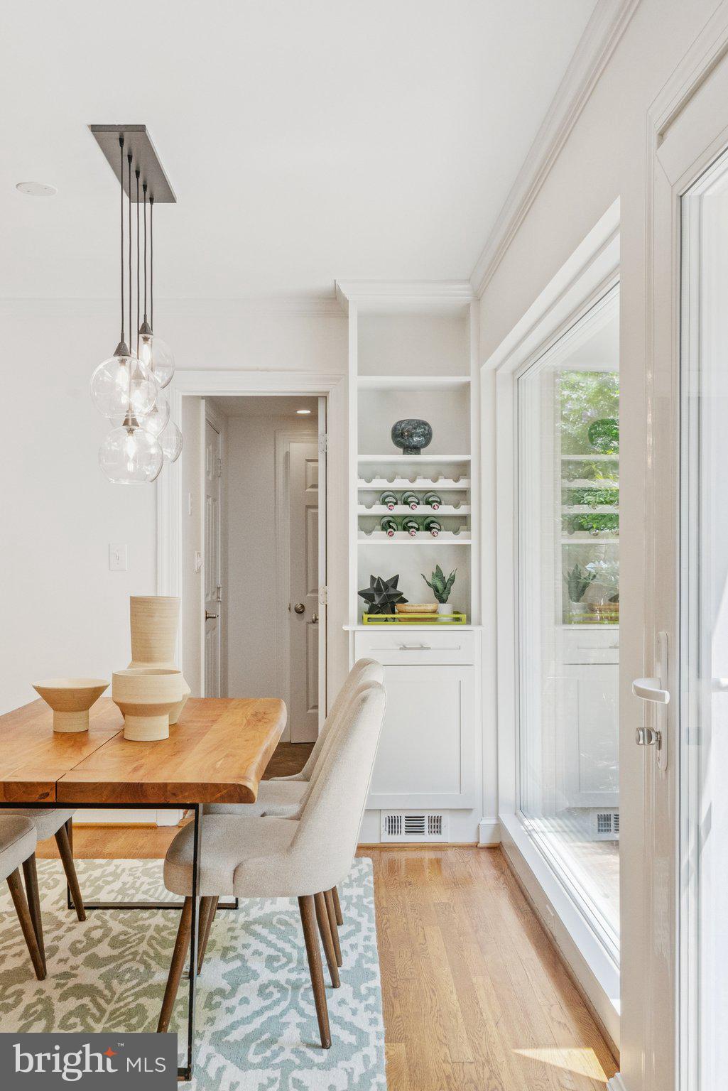 657 E Street Southeast Washington, DC 20003 - Photo 13 of 41 a view of a dining room with furniture window and wooden floor