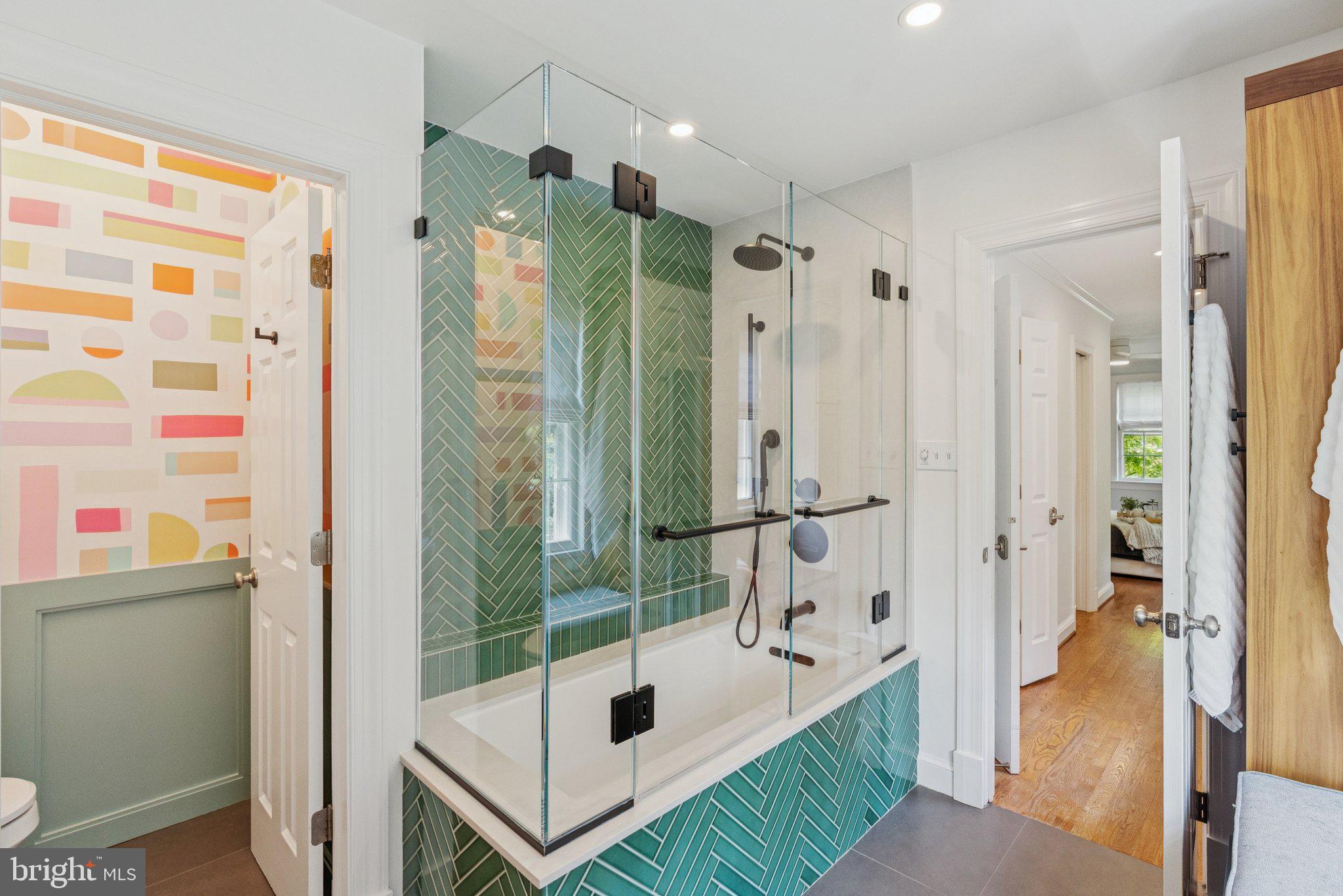 657 E Street Southeast Washington, DC 20003 - Photo 19 of 41 a bathroom with a tub shower and sink