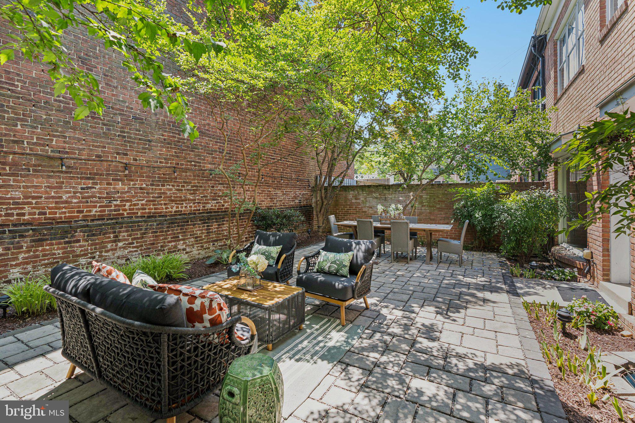 657 E Street Southeast Washington, DC 20003 - Photo 2 of 41 a view of a patio with couches and a fire pit