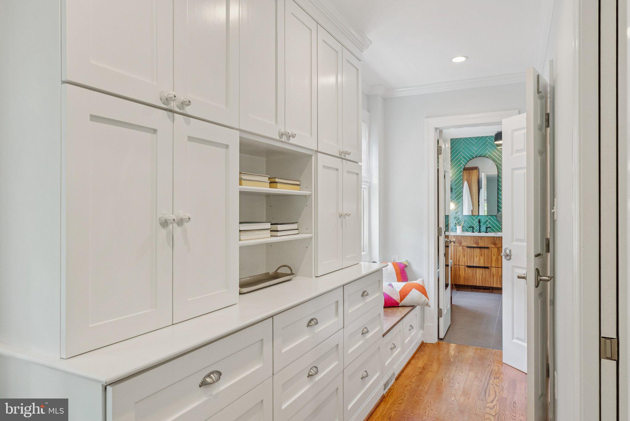 657 E Street Southeast Washington, DC 20003 - Photo 22 of 41 a hall with white cabinets and wooden floor