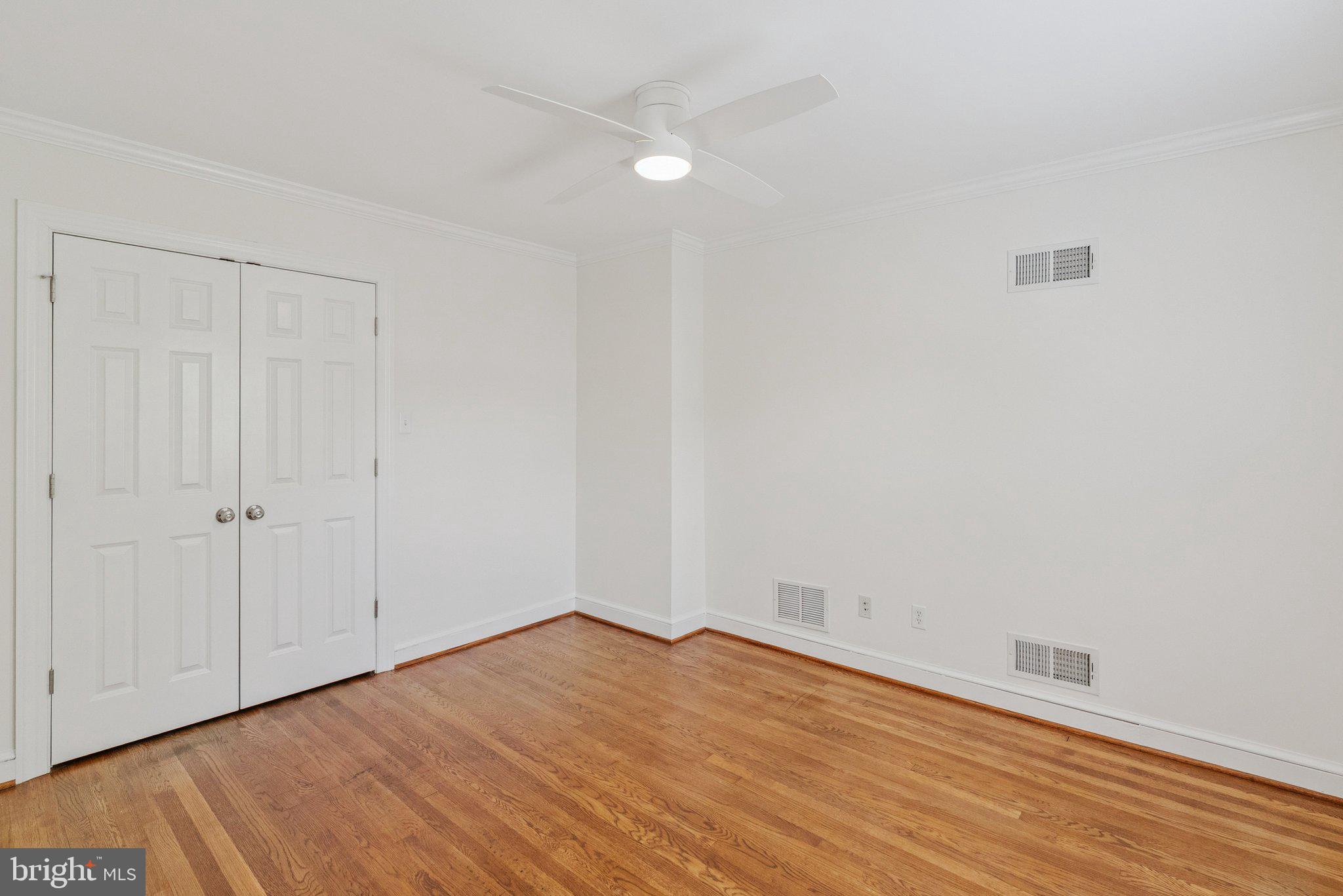 657 E Street Southeast Washington, DC 20003 - Photo 27 of 41 a view of empty room with wooden floor