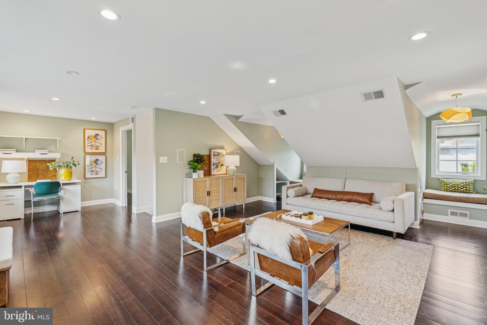 657 E Street Southeast Washington, DC 20003 - Photo 30 of 41 a bedroom with a bed and wooden floor