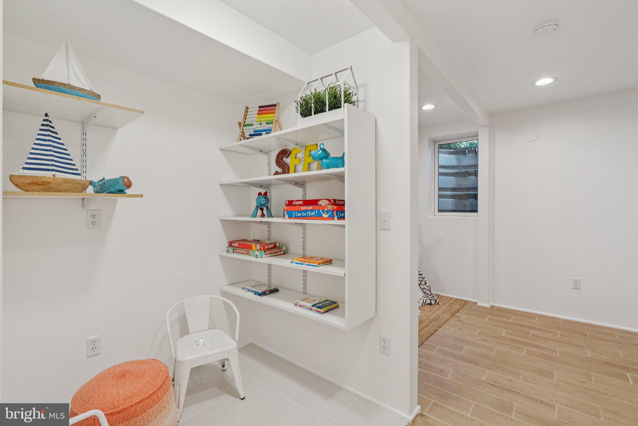 657 E Street Southeast Washington, DC 20003 - Photo 35 of 41 a room with a baby crib and a couch