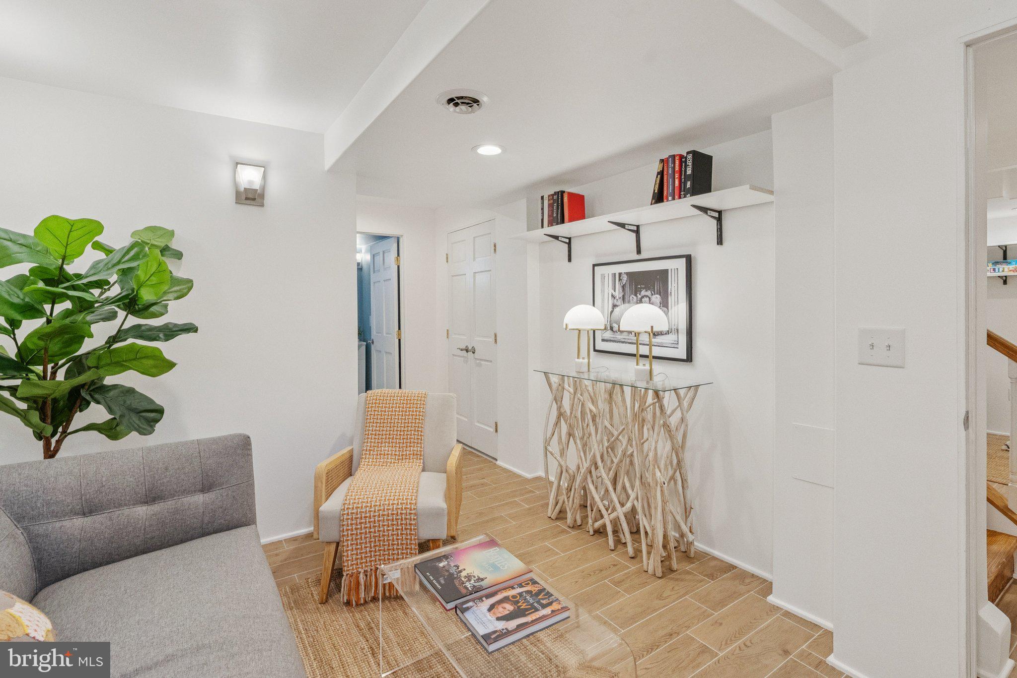 657 E Street Southeast Washington, DC 20003 - Photo 37 of 41 a living room with furniture and a couch
