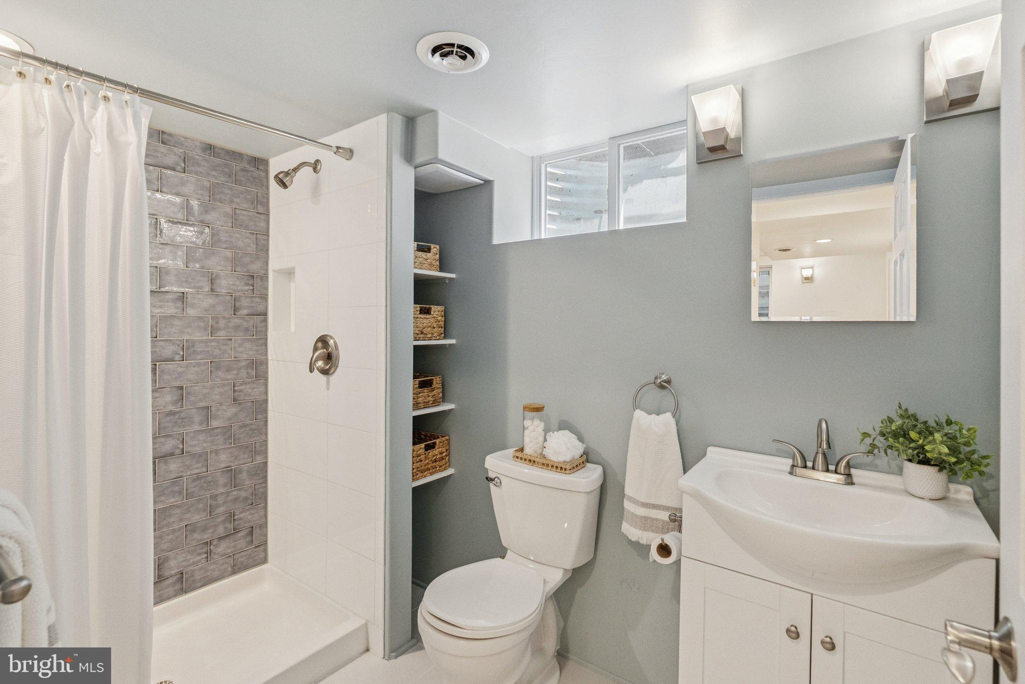 657 E Street Southeast Washington, DC 20003 - Photo 38 of 41 a white toilet sitting next to a bathroom sink